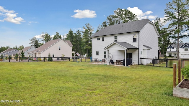 back of property featuring a lawn and a patio area