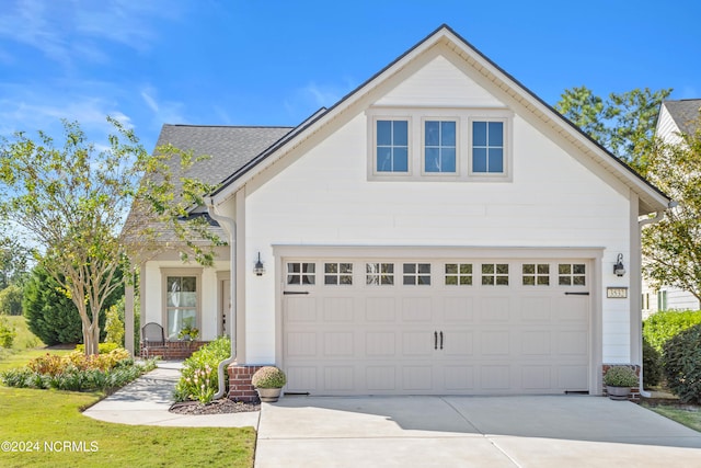 front facade with a garage