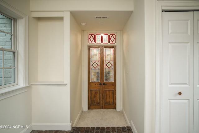 property entrance with visible vents