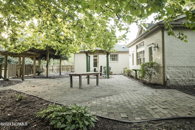 exterior space with fence and a pergola