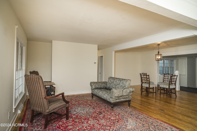 sitting room with wood finished floors and baseboards