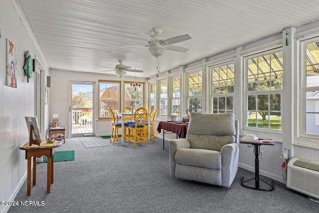 sunroom / solarium with a healthy amount of sunlight and ceiling fan