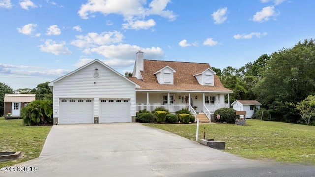 cape cod-style house featuring a garage, a front yard, and covered porch