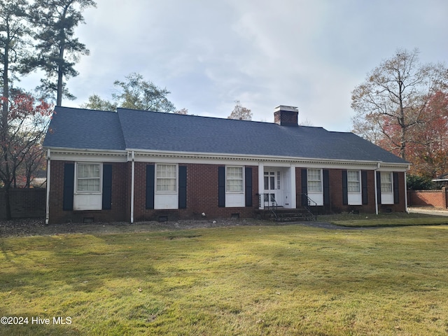 ranch-style home with a front yard