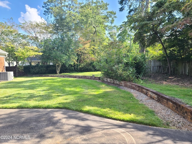 view of yard with central AC