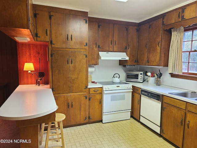 kitchen with white appliances and sink