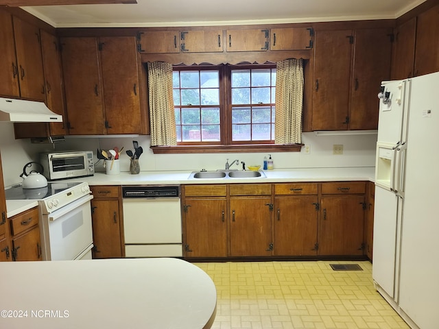 kitchen with white appliances and sink