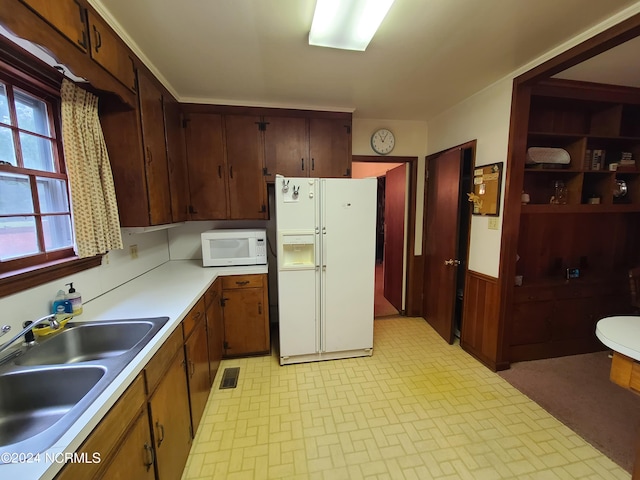 kitchen with white appliances and sink