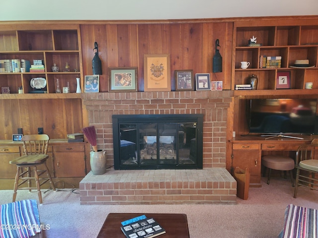 carpeted living room featuring a fireplace