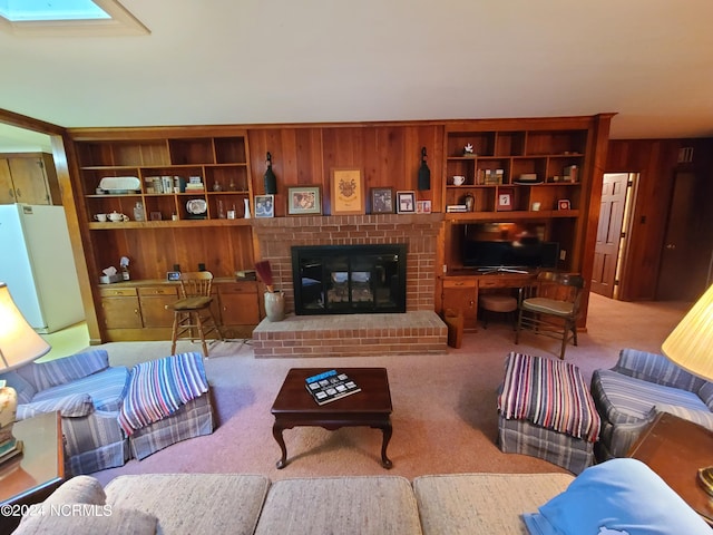 carpeted living room featuring built in features, a fireplace, and wooden walls