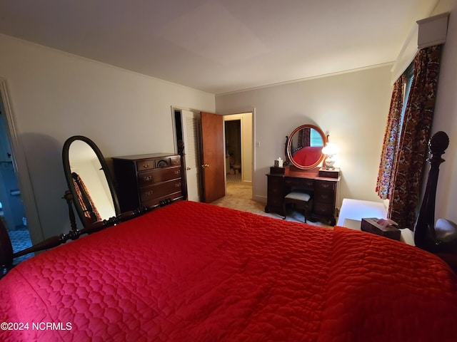 bedroom featuring light carpet