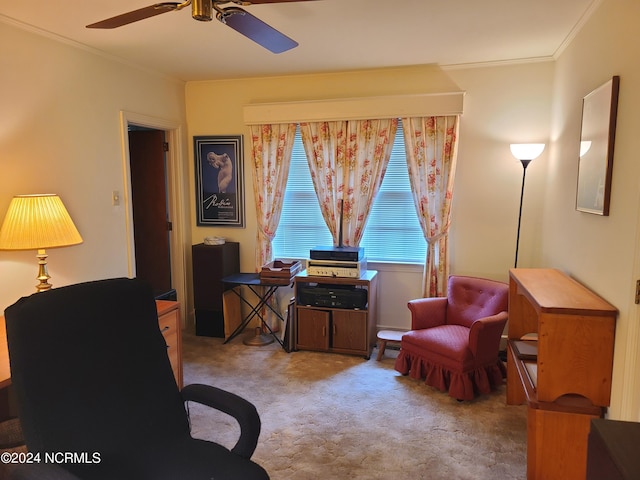 living area featuring ceiling fan, crown molding, and light carpet