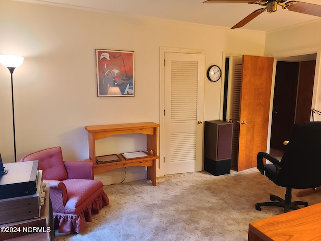 interior space featuring light carpet, ceiling fan, and ornamental molding