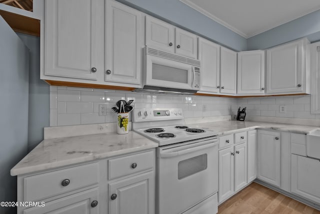 kitchen with crown molding, white cabinetry, white appliances, light hardwood / wood-style flooring, and light stone countertops