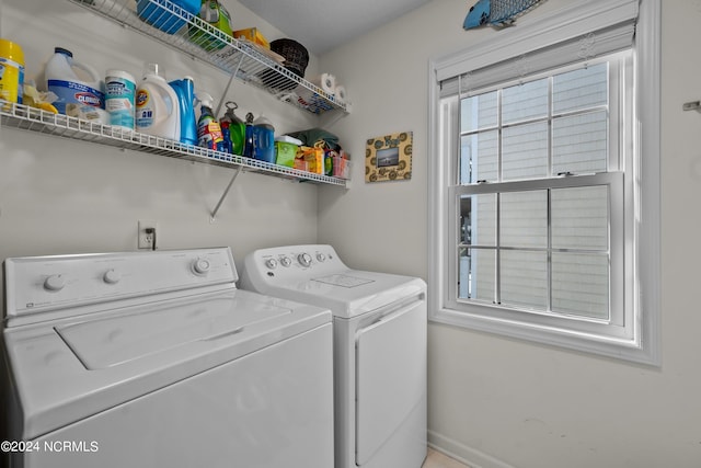 clothes washing area featuring washer and dryer