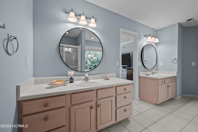 bathroom with vanity, tile patterned floors, and walk in shower