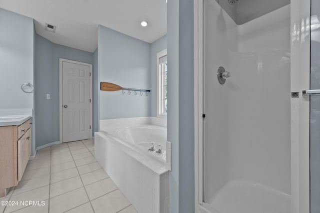 bathroom featuring vanity, separate shower and tub, and tile patterned flooring