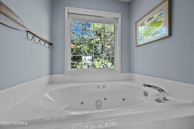 bathroom featuring tiled bath