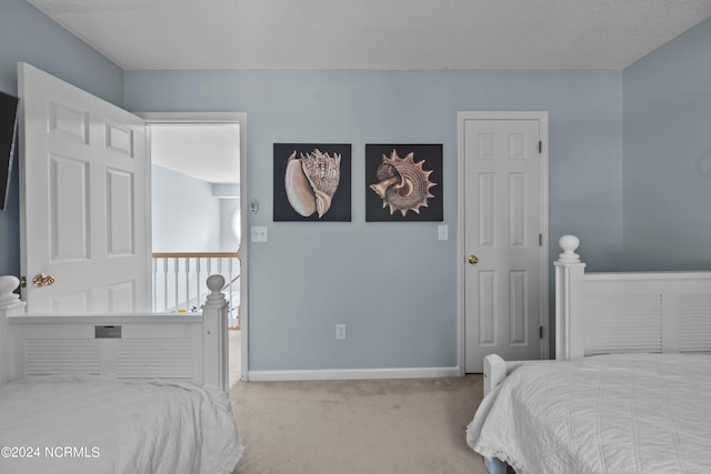 carpeted bedroom with a textured ceiling