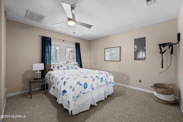 bedroom with ceiling fan, electric panel, carpet, and a textured ceiling