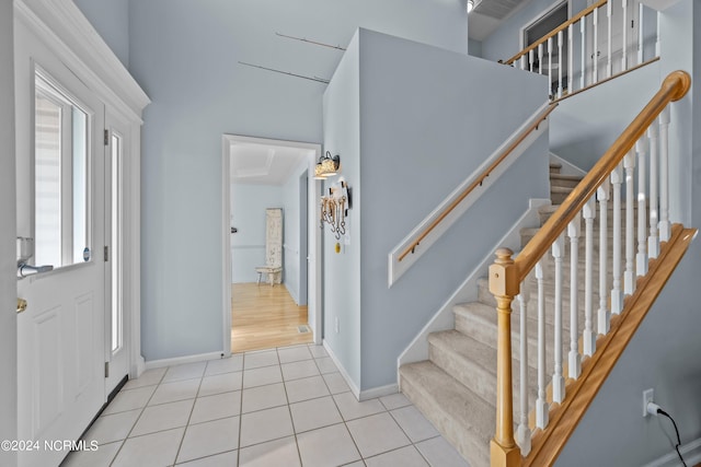 stairway featuring tile patterned floors