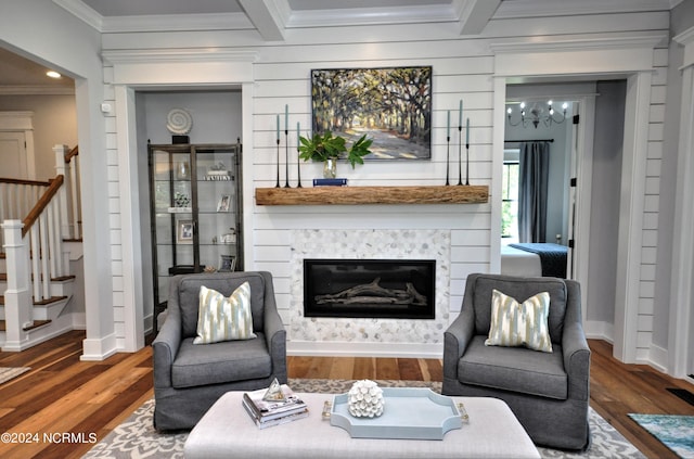 living room featuring beam ceiling, crown molding, and dark wood-type flooring