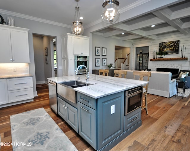 kitchen featuring sink, white cabinets, dark wood-type flooring, and appliances with stainless steel finishes