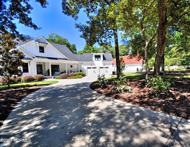 modern inspired farmhouse with a garage