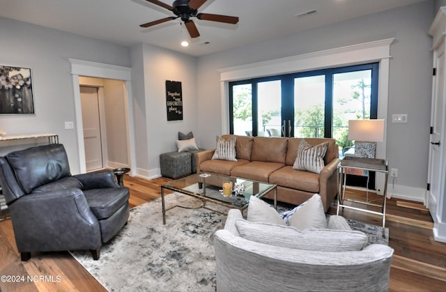 living room with hardwood / wood-style floors and ceiling fan