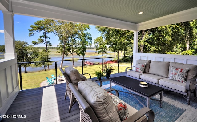 deck with outdoor lounge area and a yard