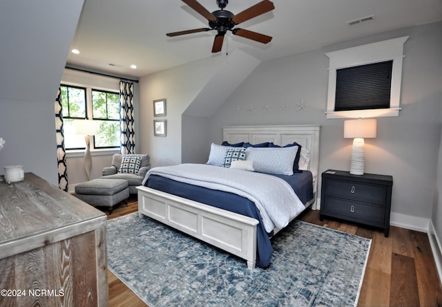 bedroom featuring ceiling fan and dark hardwood / wood-style flooring