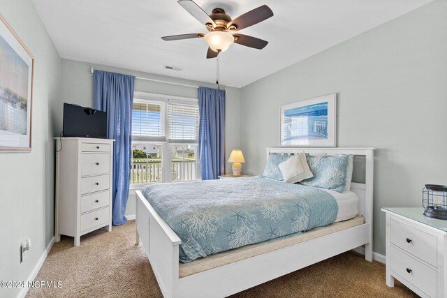 carpeted bedroom featuring ceiling fan