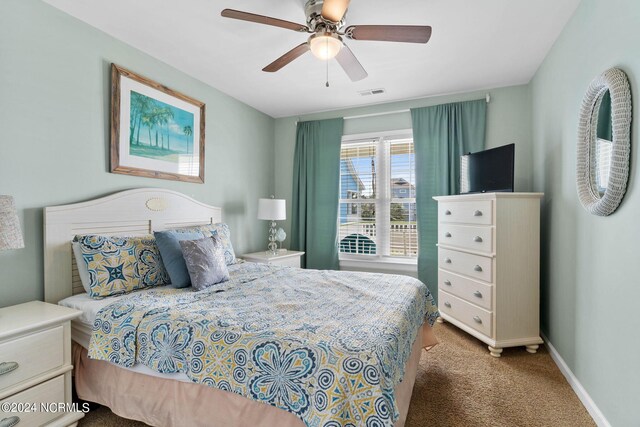 carpeted bedroom featuring ceiling fan