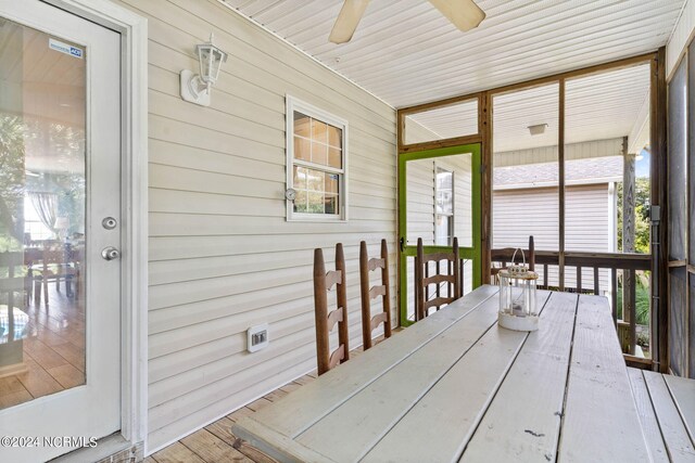 wooden deck featuring ceiling fan