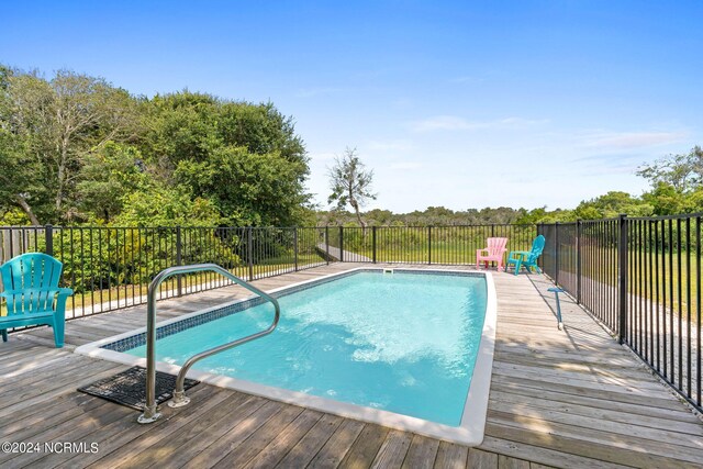 view of pool featuring a wooden deck