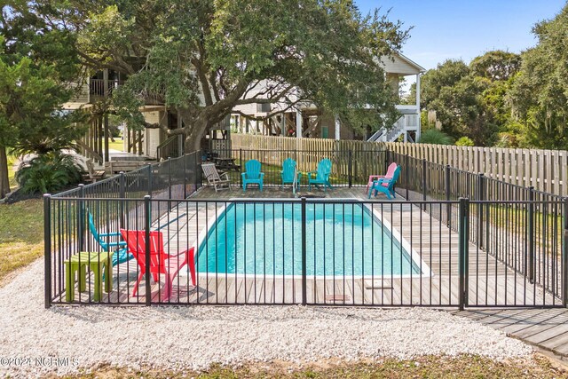 view of pool featuring a patio