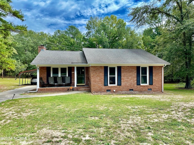 single story home with a front yard and covered porch