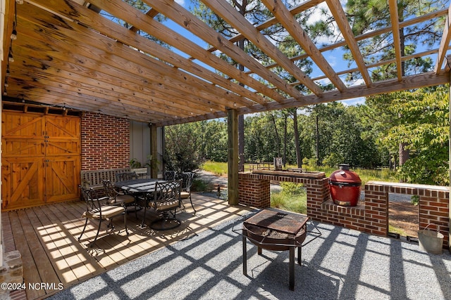 view of patio with a wooden deck and a pergola