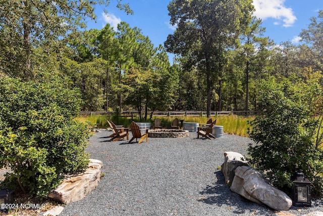 view of yard with an outdoor fire pit