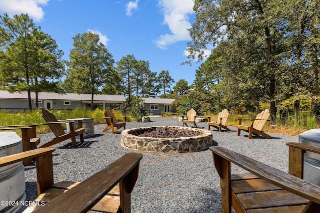 view of yard with a fire pit and a patio area