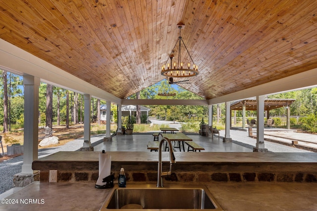 view of patio with a gazebo and sink