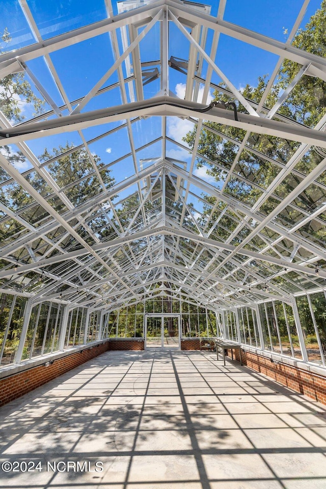 unfurnished sunroom featuring a wealth of natural light