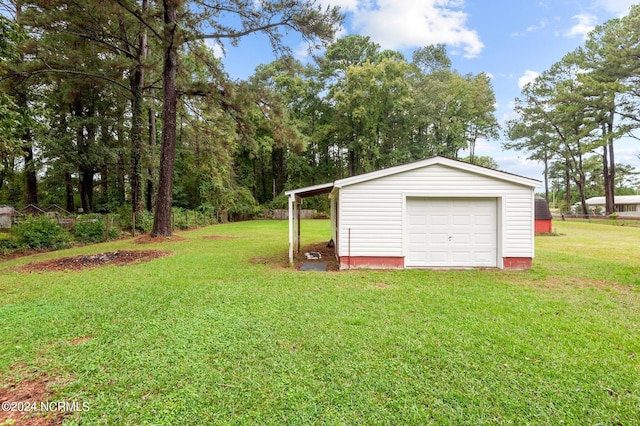 garage featuring a lawn