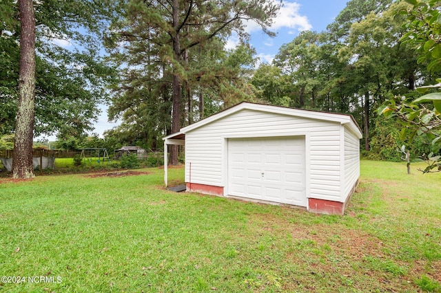 garage with a yard