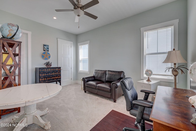 office with light carpet and ceiling fan