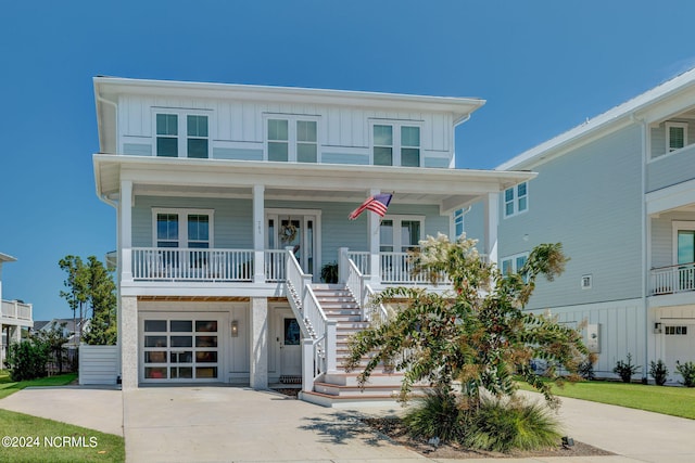 raised beach house featuring a porch