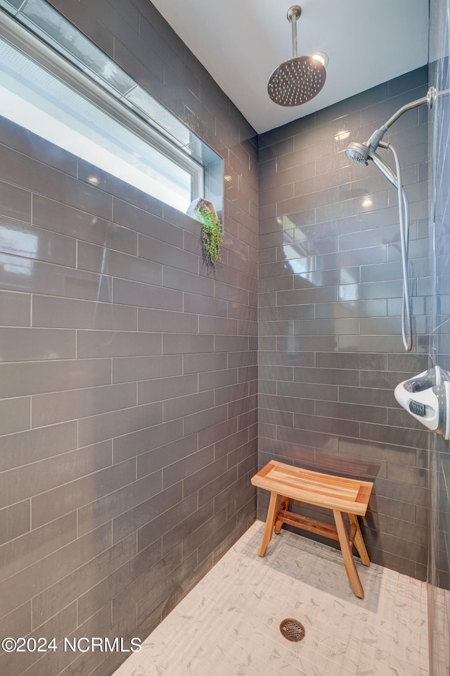 bathroom with tiled shower