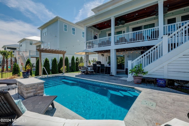 view of pool featuring a pergola, ceiling fan, and a patio