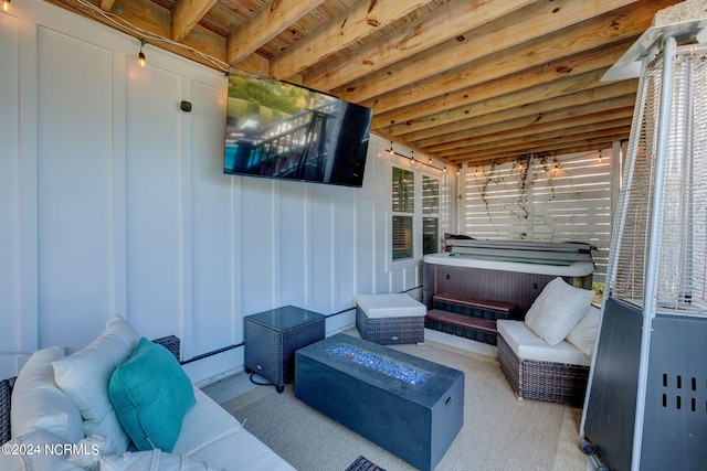 view of patio / terrace with outdoor lounge area and a hot tub