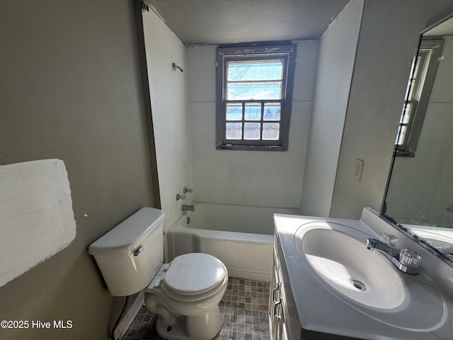 bathroom with toilet, bathtub / shower combination, and vanity